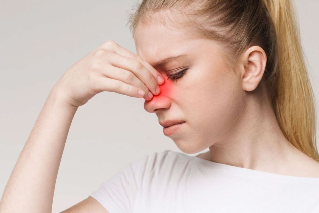 Traveler experiencing sinus pressure relief after sinus surgery, showing improved comfort during air travel.